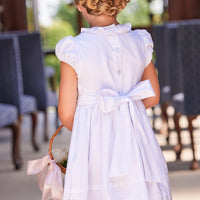 Little English traditional children's clothing. Dressy white dress with floral smocking for little girls for Spring. Special occasion outfit for toddler girl