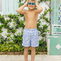 Little English traditional children's clothing. Blue swim trunks with alligator print for little boys for summer