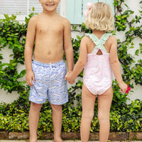 Little English traditional children's clothing. Pink swimsuit with green striped ruffled top and alligator pattern for little girls