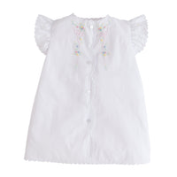 Little English traditional kids clothing. Classic white newborn gown with flutter sleeves, scallop edging, and multi-colored floral and bow embroidery