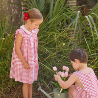 Little English traditional children's clothing. Classic dress for toddler girls in red windowpane with peter pan collar and tulip embroidery