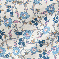 Little English traditional children's clothing. Blue, brown and cream Wisteria Floral fabric swatch