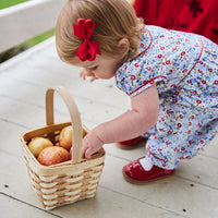 classic baby girl clothes baby girl rommper in blue and red floral print with red piping detail and peter pan collar