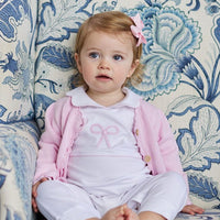 Little English traditional baby clothing, signature light pink crochet sweater with white bow for baby girl