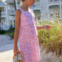 classic childrens clothing girls strappy pink and orange floral dress with pink piping and skinny bow