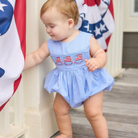 Little English traditional children's clothing.  Sleeveless bubble in royal blue mini check fabric and smocking at the chest with American flag bunting for baby boys