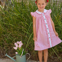 Little English traditional children's clothing. Classic dress for toddler girls in red windowpane with peter pan collar and tulip embroidery