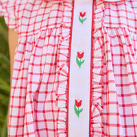 Little English traditional children's clothing. Classic dress for toddler girls in red windowpane with peter pan collar and tulip embroidery
