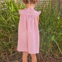 Little English traditional children's clothing. Classic dress for toddler girls in red windowpane with peter pan collar and tulip embroidery
