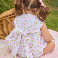 Little English traditional children's clothing.  White sleeveless smocked bubble with pink and green florals for baby girls