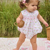 Little English traditional children's clothing.  White sleeveless smocked bubble with pink and green florals for baby girls