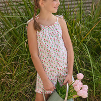 Little English traditional children's clothing.  White romper with red and pink tulip print and self-tie straps for little girls