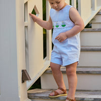 Little English traditional children's clothing.  Classic vintage cut romper for toddler boys in light blue gingham with sailboat applique across the chest