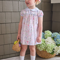Little English traditional children's clothing.  Classic peter pan dress with capped sleeves and a light blue sash in a light pink bunny print for little girls.  Easter outfit for girls.