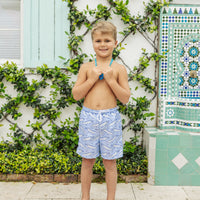 Little English traditional children's clothing. Blue swim trunks with alligator print for little boys for summer