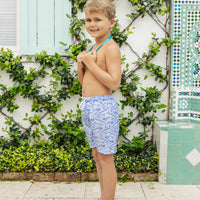 Little English traditional children's clothing. Blue swim trunks with alligator print for little boys for summer