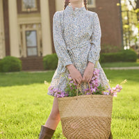 Little English traditional children's clothing. Long sleeve blue, brown, and cream floral shirt dress with tie sash for older girls.