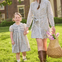 Little English traditional children's clothing. Capped sleeve blue, brown, and cream floral smocked dress with peter pan collar for little girls.