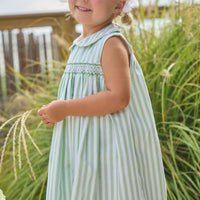 Little English traditional children's clothing.  Classic sleeveless smocked peter pan dress with soft green and white stripes for little girls