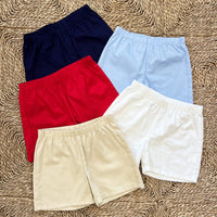 Little English boy's basic elastic waist shorts in ed, navy, light blue, white, and pebble twill