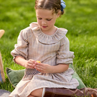 Little English traditional children's clothing.  Long sleeve blouse in tan and blue Durham Windowpane with a ruffled collar paired with matching skirt with blue smocked waistband for girls