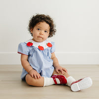 Little English traditional children's clothing.  Short sleeve royal blue gingham bubble with white bib collar with applique apples for baby girls
