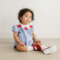 Little English traditional children's clothing.  Short sleeve royal blue gingham bubble with white bib collar with applique apples for baby girls