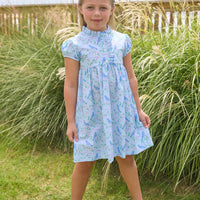 Little English traditional children's clothing.  Light blue dress with blue bird and cherry blossom print for little girls