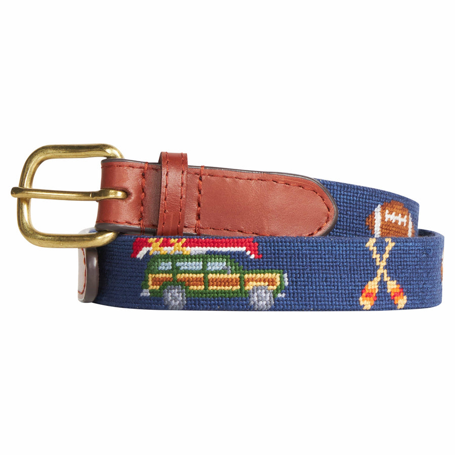 Little English traditional children's clothing.  Navy needlepoint belt with traditional fall motifs for boys. Wagoneer with canoe, crossed oars, lab, and football motifs.