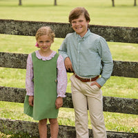 Little English traditional children's clothing. Green Watercress Gingham button down with tan Pebble Twill Classic Pants for boys. Watercress Green and pink floral long sleeve jumper set for girls.