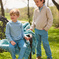 Little English traditional children's clothing.  Classic long sleeve peter pan shirt in blue Alpine Gingham paired with blue Alpine Corduroy pull on pants for toddler boys.  Older boys gray quarter zip sweater layered over blue Alpine Gingham button down shirt and paired with blue Alpine Corduroy classic pants.
