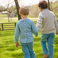 Little English traditional children's clothing.  Classic long sleeve peter pan shirt in blue Alpine Gingham paired with blue Alpine Corduroy pull on pants for toddler boys.  Older boys gray quarter zip sweater layered over blue Alpine Gingham button down shirt and paired with blue Alpine Corduroy classic pants.