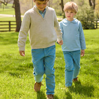 Little English traditional children's clothing.  Classic long sleeve peter pan shirt in blue Alpine Gingham paired with blue Alpine Corduroy pull on pants for toddler boys.  Older boys gray quarter zip sweater layered over blue Alpine Gingham button down shirt and paired with blue Alpine Corduroy classic pants.