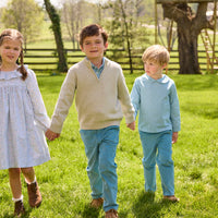 Little English traditional children's clothing.  Classic long sleeve peter pan shirt in blue Alpine Gingham paired with blue Alpine Corduroy pull on pants for toddler boys.  Older boys gray quarter zip sweater layered over blue Alpine Gingham button down shirt and paired with blue Alpine Corduroy classic pants. Ruffled collar long sleeve Bespoke Dress for little girls in blue and green Waterbury Floral