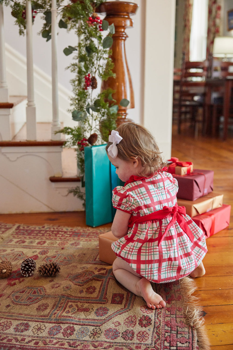 Little English classic baby girl bubble in holiday plaid with red bow around waist