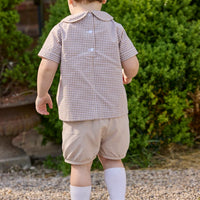 Little English traditional children's clothing.  Short sleeve pleated peter pan shirt in khaki gingham paired with khaki stone corduroy banded shorts.  Fall set for toddler boys.