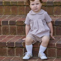 Little English traditional children's clothing.  Short sleeve pleated peter pan shirt in khaki gingham paired with khaki stone corduroy banded shorts.  Fall set for toddler boys.