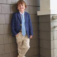 Little English classic wool blazer in navy, button down shirt in white oxford, classic pant in light pink twill, neck tie with golf cart motifs, for little boy 