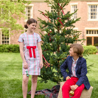Little English classic children's clothing. Girls A-line dress in red and green plaid with red bow and red piping detail for the holidays.  Boys Douglas Plaid button down shirt with red corduroy pants and navy wool blazer.