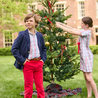 Little English classic children's clothing. Girls A-line dress in red and green plaid with red bow and red piping detail for the holidays.  Boys Douglas Plaid button down shirt with red corduroy pants and navy wool blazer.