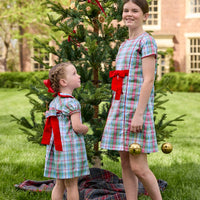 Little English classic children's clothing. Girls A-line dress in red and green plaid with red bow and red piping detail for the holidays