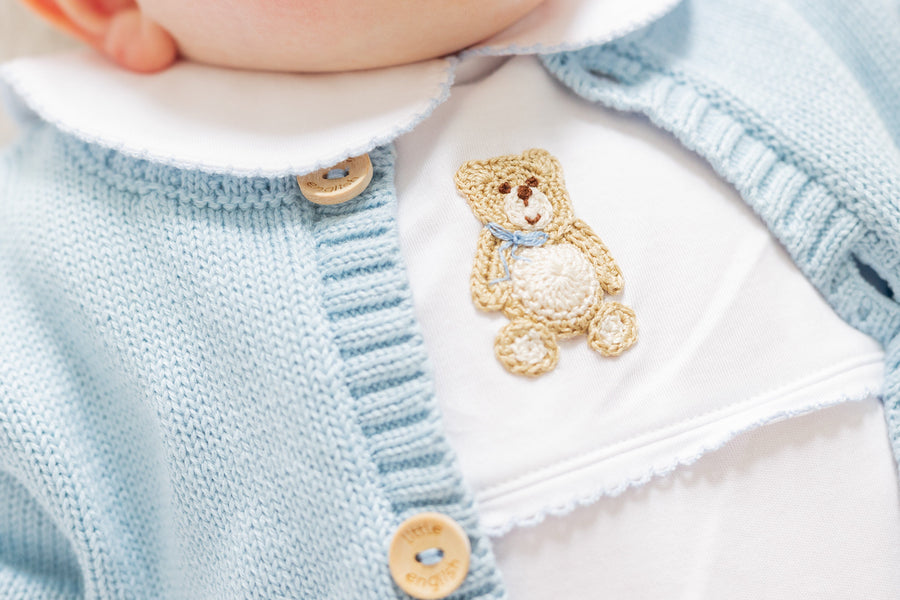 little english classic children's clothing baby boys white playsuit with crochet teddy bear and peter pan collar with light blue details 