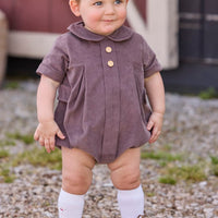 Little English traditional children's clothing company.  Short sleeve peter pan bubble in chocolate brown corduroy with wood button details for baby boys