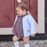 Little English traditional children's clothing company.  Short sleeve peter pan bubble in chocolate brown corduroy with wood button details for baby boys.  Paired with light blue cardigan with crochet abs on each side.