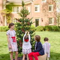 Little English classic children's clothing. Girls A-line Cora Dress in red and green plaid with red bow and red piping detail for the holidays.  Boys Douglas Plaid button down shirt with red corduroy pants and navy wool blazer. Toddler girls Eleanor Dress - Douglas Plaid with ruffled peter pan collar and tie sash in back paired with white Holiday Bow Fair Isle Cardigan.  Toddler boys Douglas Plaid Button Tab John John Set