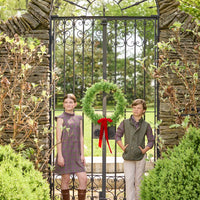 Little English traditional children's clothing. Olive and maroon Thornhill Plaid column dress with capped sleeves, ruffled neckline, and fixed bow in back for older girls for the holidays.  Boys Button Down Shirt in Thornhill Plaid with Classic Quilted Vest in Olive layered over top. Paired with Classic Pant in tan Stone Corduroy.