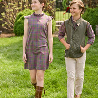 Little English traditional children's clothing. Olive and maroon Thornhill Plaid column dress with capped sleeves, ruffled neckline, and fixed bow in back for older girls for the holidays.  Boys Button Down Shirt in Thornhill Plaid with Classic Quilted Vest in Olive layered over top. Paired with Classic Pant in tan Stone Corduroy.