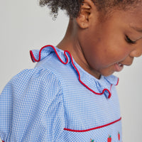 Little English toddler girl traditional blue woven dress with apple embroidery