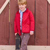 Little English traditional children's clothing.  Classic long sleeve light blue polo and chocolate brown corduroy pants with seated lab embroidery for boys. Layered with red quilted jacket with corduroy details.