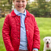 Little English traditional children's clothing.  Classic long sleeve light blue polo and chocolate brown corduroy pants with seated lab embroidery for boys. Layered with red quilted jacket with corduroy details.